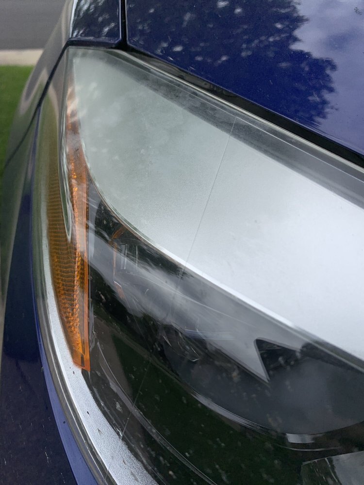 Close-up of glossy clear coat beside a headlight