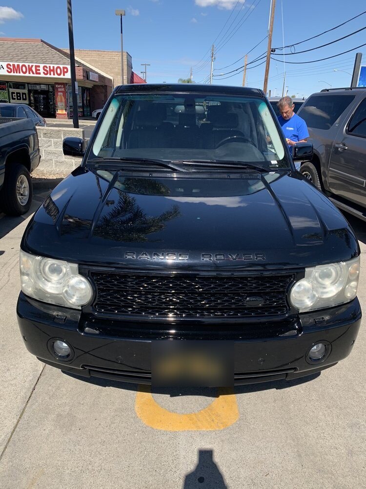 Front end of a black Range Rover after detailing