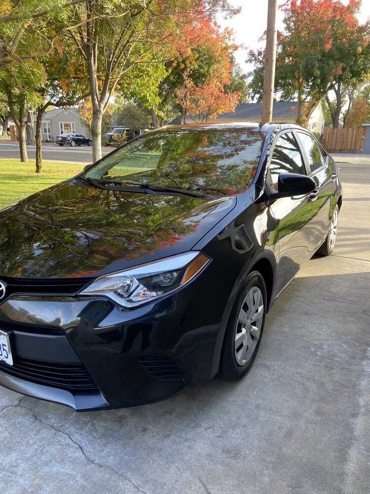 Black Corolla after exterior and interior detailing